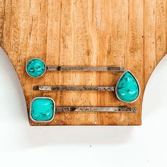 Set of three silver hair pins. Each hair pin has a single turquoise stone in a different shape. These shapes include a circle, teardrop, and a square. These hair pins are pictured on a brown block on a white background. Western Bride, Grooms Gift, Hand Pin, Western Turquoise, Turquoise Hair, Giddy Up Glamour, Cute Accessories, Hair Flip, Dress Inspo