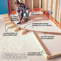 a man is working on the floor in his house with wood framing and insulations