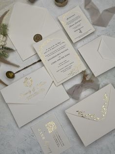 the wedding stationery is laid out and ready to be put into their guests'bags