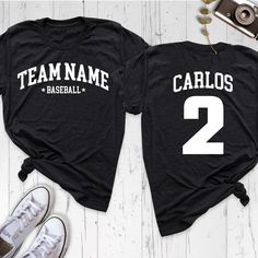 Baseball Team Shirt, Custom Name Number Shirt, Baseball Fan Mom Shirt, Baseball Lover Shirt, Personalized Game Day Shirt, Sports Dad Shirt Show your team spirit with our Baseball Team Shirt, perfect for passionate fans and players alike! Whether you're a proud mom or dad cheering from the stands, this Custom Name and Number Shirt adds a personal touch to your game day outfit. Our Baseball Mom Shirt and Sports Dad Shirt are ideal for supporting your favorite player, while the Baseball Lover Shirt Casual Moisture-wicking Shirt For Team Events, Black Tops With Team Spirit Lettering, Black Tops With Name Print For Baseball Season, Black Tops With Name Print For Team Events, Black Tops With Lettering For Sports Events, Sports Fan Apparel Tops With Lettering, Casual Breathable Tops For Team Events, Casual Moisture-wicking Tops For Team Events, Team Spirit Tops With Letter Print For Sports Events