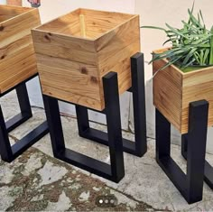 three wooden planters sitting next to each other