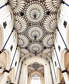 an ornate ceiling in the middle of a building