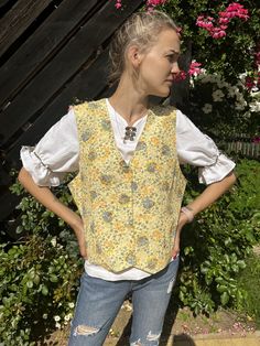 "Vintage Pale Yellow Floral Print Womens Vest Colored Floral Print Waistcoat Sleeveless Jacket Extra Large  Size Vest Label size: XL/46 Estimated size: XL Material: 100% VIscose Measurements: (lying flat) Length: 23\" / 58 cm Pit to pit: 21,5\" / 55 cm Waist: 20\" / 51 cm Please check measurements to insure a proper fit. Remember to allow yourself some extra room for movement. You can compare these with something from your closet that fits you well. This vest will come to you freshly laundered a Yellow Sleeveless Vest For Fall, Spring Cotton Vest For Daywear, Cotton Vest For Spring Daywear, Vintage Spring Vest Outerwear, Spring Cotton Sleeveless Blouse Vest, Spring Sleeveless Cotton Vest, Sleeveless Fall Vest For Daywear, Bohemian Sleeveless Vest For Spring, Yellow Sleeveless Fall Outerwear