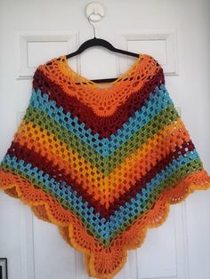 "This beautiful poncho is handmade from 100 percent acrylic yarn. It is a great addition to any woman wardrobe. The neck circumference is 35\"/89cm and lent from V down is 24\"/61cm long. The colors are beautiful and vibrant. Care: wash and dry on low temperature." Bohemian Fall Poncho In Acrylic Yarn, Bohemian Hand Knitted Poncho In Acrylic Yarn, Fall Crochet Poncho Made Of Yarn, Multicolor Cape Poncho For Fall, Multicolor Crochet Patterns For Fall, One Size Multicolor Poncho For Fall, Multicolor One Size Poncho For Fall, Handmade One-size Cape For Fall, Colorful Bohemian Poncho