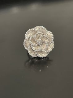 "Sterling silver flower ring set with cubic zirconias.  The length is 1 1/8\" and width is 1 1/8\".  A sweet whimsical ring that looks great on the hand in a size 6.5.  Rhodium plated so it won't oxidize." Elegant Silver Flower Diamond Ring, Silver Diamond Wedding Ring In Flower Shape, Silver Flower Diamond Ring For Formal Occasions, Silver Flower Diamond Ring For Formal Events, Silver Diamond Flower Ring For Wedding, Silver Flower Shaped Diamond Ring For Formal Occasions, Flower Shaped Diamond Ring In Silver, Silver Diamond Flower Ring, Silver Wedding Rings In Flower Shape