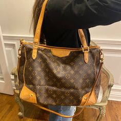 Authentic Louis Vuitton Louis Vuitton Retired Monogram Tote Crossbody Zippered Tote Bag Pre-Loved Retired Louis Vuitton Estrella Gm. Can Be Worn As A Crossbody, Satchel Or Shoulder Bag. Zip Top Closure. Includes Crossbody Strap. Scrape At Base And Lower Side As Pictured. Small Water Spot On Interior. Lv Gold Tone Zipper Pull. Includes Crossbody Strap. Certified Authentic Through Poshmark Authentication. Approximate Measurements: 14”L (At Base) X 12”H X 5”W 8" Drop Shoulder Strap 31" Crossbody St Zippered Tote Bag, Crossbody Satchel, Monogram Tote, Zipper Tote Bag, Water Spots, Zippered Tote, Zip Top, Crossbody Strap, Authentic Louis Vuitton