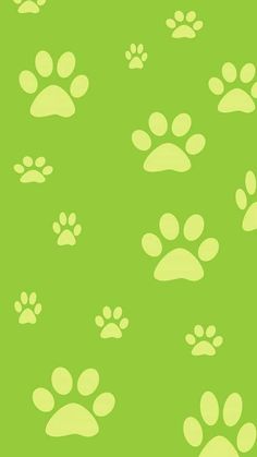 an animal paw prints pattern on a green background