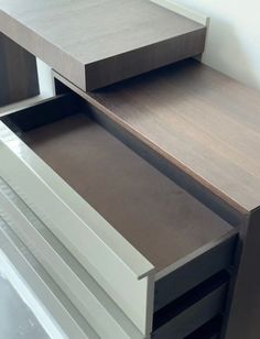 an open drawer on the side of a cabinet