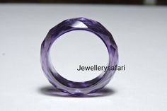 Buyer Will Receive 1 Piece Attractive Purple Amethyst Zirconia Full Faceted Gemstone Made Ring Band.you will really love it.you will gift it to your love ones and friends. Product Details Product Name - Purple Zirconia Gemstone Made Ring Band Gemstone - Zirconia Quantity - 1 Piece ----------------------------------------------------------------------------- THIS BEAUTIFUL ITEM IS AVAILABLE ONLY ON ETSY ------------------------------------------------------------------------------------ Note - Ki Modern Purple Ring For Gift, Modern Purple Amethyst Jewelry, Modern Purple Rings For Gift, Lavender Crystal Ring Gift, Modern Purple Wedding Jewelry, Faceted Amethyst Ring In Purple, Faceted Amethyst Purple Ring, Amethyst Rings With Vs Clarity, Purple Round Crystal Ring Gift