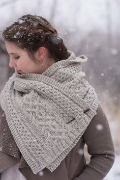 a woman wearing a scarf in the snow