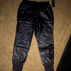 Black Faux Leather Joggers With Zipper Pockets Casual Leather Pants With Zipper For Night Out, Edgy Black Bottoms From Forever 21, Forever 21 Pants For Spring Night Out, Forever 21 Bottoms For Fall Party, Trendy Forever 21 Pants For Fall, Edgy Forever 21 Bottoms For Night Out, Casual Forever 21 Pants For Night Out, Edgy Night Out Bottoms From Forever 21, Forever 21 Party Bottoms For Fall