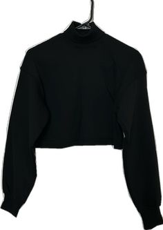 Fitted Black Sweater With Funnel Neck, Fitted Black Cropped Long Sleeve Sweater, Fitted Black Cropped Sweater, Trendy Black Cropped Sweater For Streetwear, Black Trendy Cropped Sweater For Streetwear, Black Crew Neck Winter Crop Top, Black Crew Neck Crop Top For Winter, Casual Black Crop Top For Winter, Black High Neck Top For Streetwear