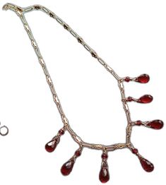 Red Ruby Drop Jewelry, Red Drop Beads For Jewelry Making, Unique Red Jewelry For Celebration, Red Garnet Dangle Earrings, Unique Hand Forged Red Jewelry, Hand Forged Red Jewelry As A Gift, Red Briolette Necklace For Formal Occasions, Hand Forged Red Jewelry For Gifts, Red Garnet Pendant Jewelry