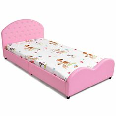 a pink toddler bed with an animal print sheet and headboard on the bottom