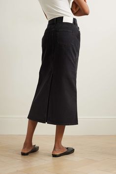 Find LOULOU STUDIO Net Sustain Rona Organic Denim Midi Skirt on Editorialist. LOULOU STUDIO's collections are packed with styles that you'll spot tastemakers wearing on the streets of Paris. Made from organic cotton, this denim skirt has a '90s-inspired midi length. Pair it with sneakers, knee boots or ballet flats. This product was created using Considered Materials. Find out more about NET SUSTAIN here. High Rise Skirt For Fall Workwear, High Rise Skirt For Workwear, Fall Season, High Rise Relaxed Denim Skirt For Workwear, High-waist Denim Skirt For Work, High Rise Denim Skirt For Work, Relaxed Fit High Waist Denim Skirt For Work, Dark Wash Straight Leg Skirt For Work, Full Length Cotton Skirt For Work, Denim Straight Leg Skirt For Work