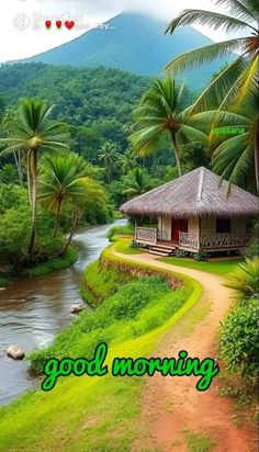 a small hut sitting on top of a lush green hillside next to a river and palm trees