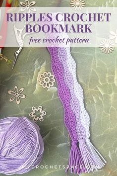 the crochet bookmark is shown with purple yarn and flowers on it's cover