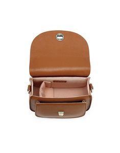 the inside of a brown purse with compartments