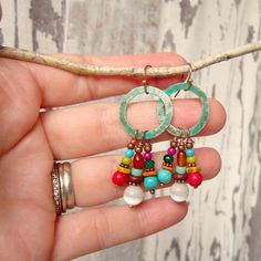 "These multi color stone dangle earrings are made of red coral, genuine turquoise, yellow jade and a colorful array of glass beads. They freely dangle from 25mm copper verdigris circle that I hand patina-ed. They measure 2\" in length from the top of the earwires. Choose from copper spacers and earwires (as pictured) or sterling silver spacers and earwires. Pair these with your southwest jewelry or simply wear them on their own. Very lightweight and comfortable for all day wear. See the matching Bohemian Red Earrings With Natural Stones, Colorful Nickel-free Dangle Beaded Earrings, Nickel-free Colorful Dangle Beaded Earrings, Multicolor Beaded Drop Earrings With Natural Stones, Multicolor Natural Stones Beaded Drop Earrings, Colorful Nickel Free Bohemian Jewelry, Colorful Vibrant Earrings With Ear Wire, Vibrant Drop Earrings Jewelry Gift, Vibrant Drop Earrings For Gifts