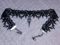 This gorgeous handmade black lace choker is absolutely stunning and has a gorgeous silver plated crow skull charm attached, giving off glam goth vibes for days 🖤 The lace part measures 12" and the choker as a whole measures 17" including clasp and extender chain... I can make the lace/ chain longer or shorter no problem, so if you need the measurements adjusting just let me know on the order and I can make it to fit your measurements 🖤 Emo Silver Choker For Halloween, Handmade Adjustable Choker For Alternative Fashion, Gothic Choker Necklace For Alternative Fashion, Gothic Choker For Halloween And Alternative Fashion, Emo Silver Choker For Party, Handmade Edgy Choker For Halloween, Emo Style Silver Choker For Party, Emo Alternative Fashion Choker, Adjustable Gothic Choker For Alternative Fashion