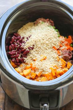 rice, beans and carrots are mixed together in the slow cooker to make this meal