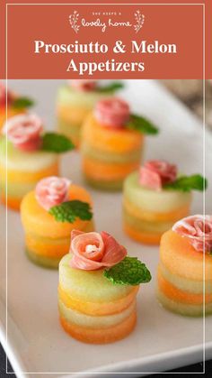 small desserts on a white plate with green leaves and pink flowers in the middle