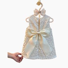 Make your little girl’s special occasions unforgettable with the Elegant Heart Princess Party Dress. Perfect for weddings, birthdays, and formal events, this beautiful dress is designed to make her feel like royalty. Our Elegant Heart Princess Party Dress features a timeless design with delicate heart details, making it the perfect choice for any formal event. Crafted from high-quality fabric, this dress combines comfort with elegance, ensuring your toddler stays comfortable throughout the day. The dress is adorned with subtle heart patterns and a classic silhouette that enhances the princess-like charm. Ideal for weddings, baptisms, birthday parties, or any celebration, this dress is sure to make your child stand out. Imagine your little princess walking into a room, all eyes on her in th Fitted Princess Dress With Bow For Dress-up, Elegant Summer Holiday Dress-up Dress, Elegant Sleeveless Dresses For Pageants, Fitted Princess Dress With Lace Bodice For Dress-up, Cream Party Dress With Bow, Fitted Baptism Dress With Bow, Fitted Princess Dress With Bow, Elegant Sleeveless First Communion Dress For Pageant, Sleeveless Ruffled Holiday Dress For Wedding