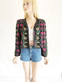 Gorgeous vintage 80's/90's beaded cropped jacket. Tags still attached. Missing some beads in the first row on the collar. Not noticeable. In great vintage condition Tag size large. Runs small Beaded Vintage Outerwear For Spring, Vintage Beaded Outerwear For Spring, 80s Cropped Jacket, Fitted Embroidered Vintage Outerwear, Vintage Beaded Party Outerwear, Spring Vintage Beaded Outerwear, Vintage Fitted Sequin Outerwear, Vintage Beaded Cardigan, Plaid Poncho