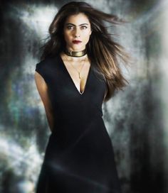 a woman with long hair wearing a choker and black dress, standing in front of a dark background