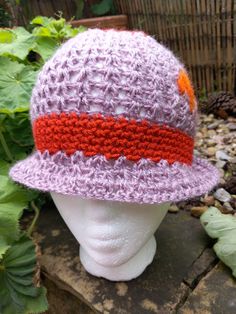 Woman's Cloche Hat, Hand crocheted and felted in a Unique Design to fit sizes 54cm - 58cm.  Light Purple with Orange Band and Orange, Felt Embellishments . Wool Crochet Hat, One Size Fits Most, Hand Knitted Purple Yarn Hats, Purple Brimmed Crochet Hat, Knitted Short Brim Hat, Purple Hand Knitted Brimmed Hat, Purple Crochet Brimmed Hat, Handmade Fitted Brimmed Crochet Hat, Crochet Hat With Curved Brim, Fitted Crochet Hat With Curved Brim