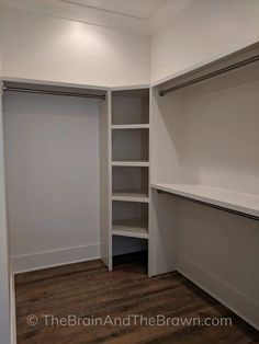 an empty walk in closet with white walls