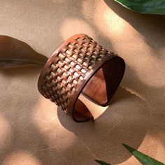 Introducing one of our exquisite designs, the Nature-Inspired Leather Bracelet--a harmonious blend of natural elegance and artisanal craftsmanship. This bracelet reflects the purity and grace found in nature. Made from premium, vegetable-tanned leather, it is expertly woven with brass accents, creating a piece that exudes both warmth and refinement. With its minimalist yet captivating design, this bracelet is the perfect accessory for any occasion. Whether you're attending an evening soiree, heading to the office, or enjoying a weekend stroll, its subtle sophistication complements any attire. Each wear invites admiration, as the bracelet quietly conveys a sense of understated beauty and heartfelt sincerity--an elegant statement of nature's timeless charm. 🌱 One Size Fits All: The adjustab Lampang, Bracelet Minimalist, String Bag, Nature Inspired Jewelry, Elegant Bracelet, Leather Weaving, Brass Accents, Leather Jewelry, Vegetable Tanned Leather