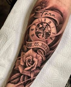 an arm with a clock and roses on it