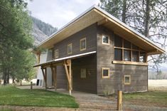 three pictures of a house in the woods with windows and wood sidings on each side