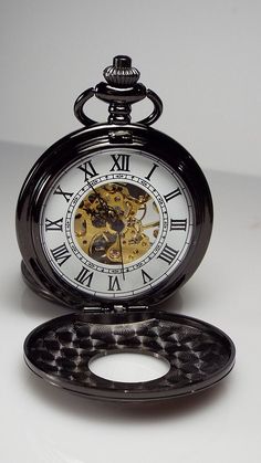 "Personalized pocket watches make great gifts for a birthday, Christmas, graduation, your best man or groomsmen, father of the bride or groom, Father's day, a retirement, or any special occasion! This beautiful watch has a lovely gloss black finish, and with the jeweled mechanical movement it truly looks vintage! The front cover has a center cut out with factory embossed roman numerals, and is framed with fancy scrolls. The back cover is smooth and ready to be engraved with a monogram, name, ini Orv Pocket Watch, Vintage Clocks, Mechanical Clock, Mechanical Pocket Watch, Cool Clocks, Vintage Timepiece, Skeleton Watches, Pocket Watch Antique, Vintage Pocket Watch