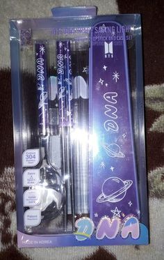 the package contains three pens and two spoons with space themed writing on each pen