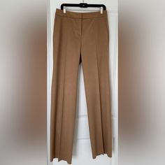 Classic, Elegant And Very On Trend Wide Leg Pants By The Luxury Brand Maxmara Made Of 100% Fine, Pure Camel Hair That Is Extremely Soft And Warm Signature Pick-Stitched Slash Side Pockets And Fly Double Bar Tab, Inside Button And Zipper Closure Serge-Finished Leg Edge Ready To Hem To Your Desired Length Includes Two Extra Buttons Waist 17-1/2” Seam To Seam Leg Opening 10-1/2” Seam To Seam Made In Italy Beige Straight Hem Pants For Office, Luxury Brown Workwear Pants, Elegant Beige Straight Leg Pantsuit, Elegant Beige Pantsuit With Straight Legs, Elegant Fitted Brown Wide Leg Pants, Luxury Beige Workwear Pants, Elegant Brown Wide Leg Pants For Office, Beige Straight Leg Pantsuit For Formal Occasions, Beige Straight Leg Formal Pantsuit