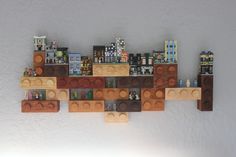 a wooden shelf that has some legos on it