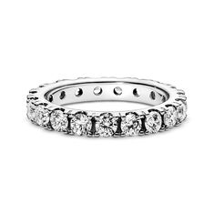 Make a classic statement with the Sparkling Row Eternity Ring. Hand-finished in sterling silver, this eternity ring features a band inlaid with sparkling clear man-made cubic zirconia. The design looks equally beautiful worn solo or stacked with other rings. Style it with bands in similar tones to create a monochromatic look, or go for contrasting metals for a combination that pops. This ring is designed to be a wardrobe essential for years to come. Classic Diamond Promise Ring With Sparkling Stones, Classic Rings With Sparkling Round Cut Stones, Classic Cubic Zirconia Rings With Sparkling Stones, Classic Diamond Ring With Sparkling Stones, Classic Diamond White Ring With Sparkling Stones, Classic Round Diamond Ring With Sparkling Stones, Classic White Gold Diamond Ring With Sparkling Stones, Pandora Ring, Rings Style