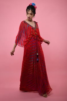 Red kaftan tunic with all-over multicolored Leheriya print, embroidered V-neckline and asymmetric hem. Comes with braided tie-up belt.
Component: 2
Printed, Embroidered
Neckline: V-Neck
Sleeve Length: Three Quarter
Fabric: Georgette
Color: Red
Asymmetric hem
Braided belt with tassels
Note: The inner slip and headscarf worn by the model is not for sale - Aza Fashions Red Kaftan, Kaftan Tunic, Kaftan For Women, Braided Belt, Embroidered Neckline, Head Scarf, Asymmetric Hem, Aza Fashion, Three Quarter