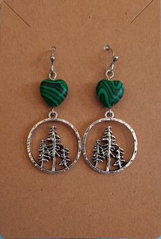 These pretty evergreen earrings remind me of the beloved PNW.  They're accented with a green stone heart bead and hang on stainless steel hooks.