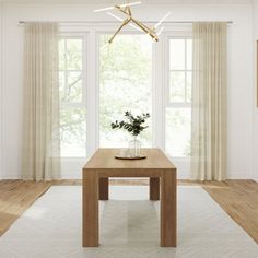 a living room with white walls and wooden floors, a table in front of two windows