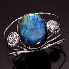 Blue Fire Labradorite Bangle, 925 Sterling Silver,Gemstone Bangle,Gift For Her,Unique Bangle, Stylish Bangle, Trending Bangle, Birthday Gift -------------------------------------------------------------------------------------- Labradorite Stone Benefit Labradorite is considered a tremendously spiritual stone, especially helpful for people who tend to overwork. It helps an individual regain energy while aiding the body and spirit in healing itself. In the metaphysical world, labradorite is consi Healing Silver Gemstone Bracelets, Labradorite Round Bracelet Gift, Adjustable Gemstone Bangle, Adjustable Round Bangle With Gemstone, Adjustable Round Gemstone Bangle, Unique Labradorite Bangle Jewelry, Sterling Silver Cabochon Bracelet As A Gift, Silver Cabochon Cuff Bracelet Gift, Elegant Labradorite Bracelets For Gifts