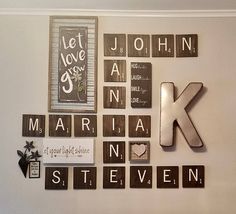 the letters are made up of wood blocks and magnets on the wall above them