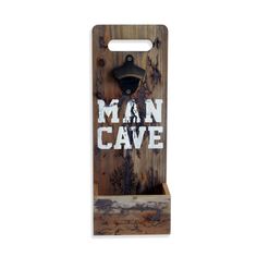 a bottle opener with the word man cave on it