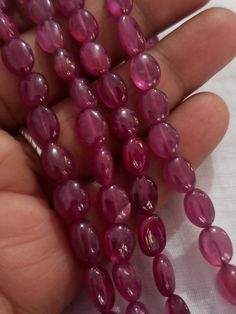 AAA 478 Carat Fine Quality Natural Ruby Smooth Plain 20 Inch Necklace Adjustable code Stone :Natural Ruby Shape :- fancy oval Necklace - 20 inch 2 line string Size :- 5x7mm to 10x12mm Weight :- 478 carat Polish :- Handmade Purity :- 100% Natural Gemstone color - red makes a great gift for your loved ones. It is known as the 'love stone' as the message it emits is the strong vibration of unconditional love, joy, warmth and healing. As quartz crystals are profound amplifiers of energy, it may help Polished Oval Beads Gems And Cabochons For Gift, Oval Polished Beads For Gifts, Oval Hand-strung Beaded Necklaces As Gifts, Oval Hand-strung Beaded Necklace For Gift, Spiritual Oval Beaded Necklace With Gemstone Beads, Oval Natural Stone Beads For Gifts, Oval Natural Stones For Jewelry Making, Spiritual Oval Gemstone Beads, 20 Inch Necklace