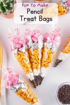 some candy sticks are wrapped in plastic bags with bows on them and the words, fun to make pencil treat bags