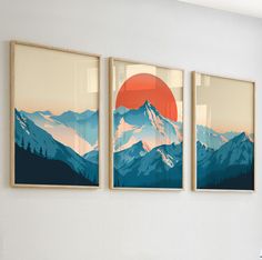 three paintings on the wall with mountains in the background