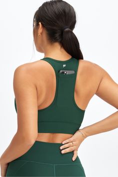 On-The-Go Medium Impact Sports Bra Fabletics green female Activewear >> Womens >> Sports Bras >> Medium Impact Knit regular Training 4-Way Stretch/Removable Bra Cups Our fan-favorite pocket bra Fabletics FIT App Trained Approved Green Sports Bra With Built-in Padding For Gym, Green Sports Bra With Built-in Padding For Training, Green Athleisure Sports Bra With Built-in Padding, Green Sports Bra With Built-in Padding, Green Compressive Sleeveless Sports Bra, Green Athleisure Sports Bra, Green Athleisure Sleeveless Sports Bra, Green Compressive Sports Bra For Light Sports, Functional Green Sleeveless Sports Bra