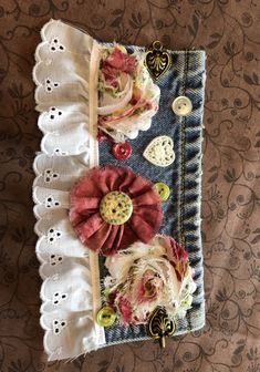 a piece of cloth with flowers and buttons on it